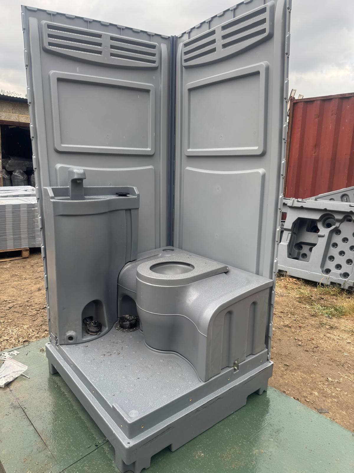 Toilet and hand wash basin fitted to base